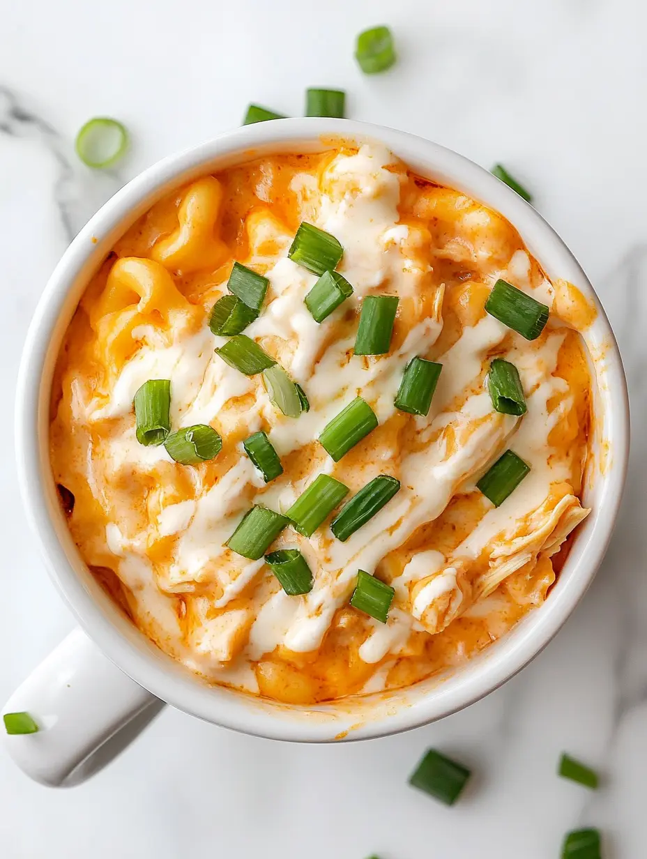 Buffalo Chicken Mug Mac & Cheese: Quick, Cozy, and Microwave-Ready 12 Overhead view of buffalo chicken mac and cheese topped with ranch and green onions